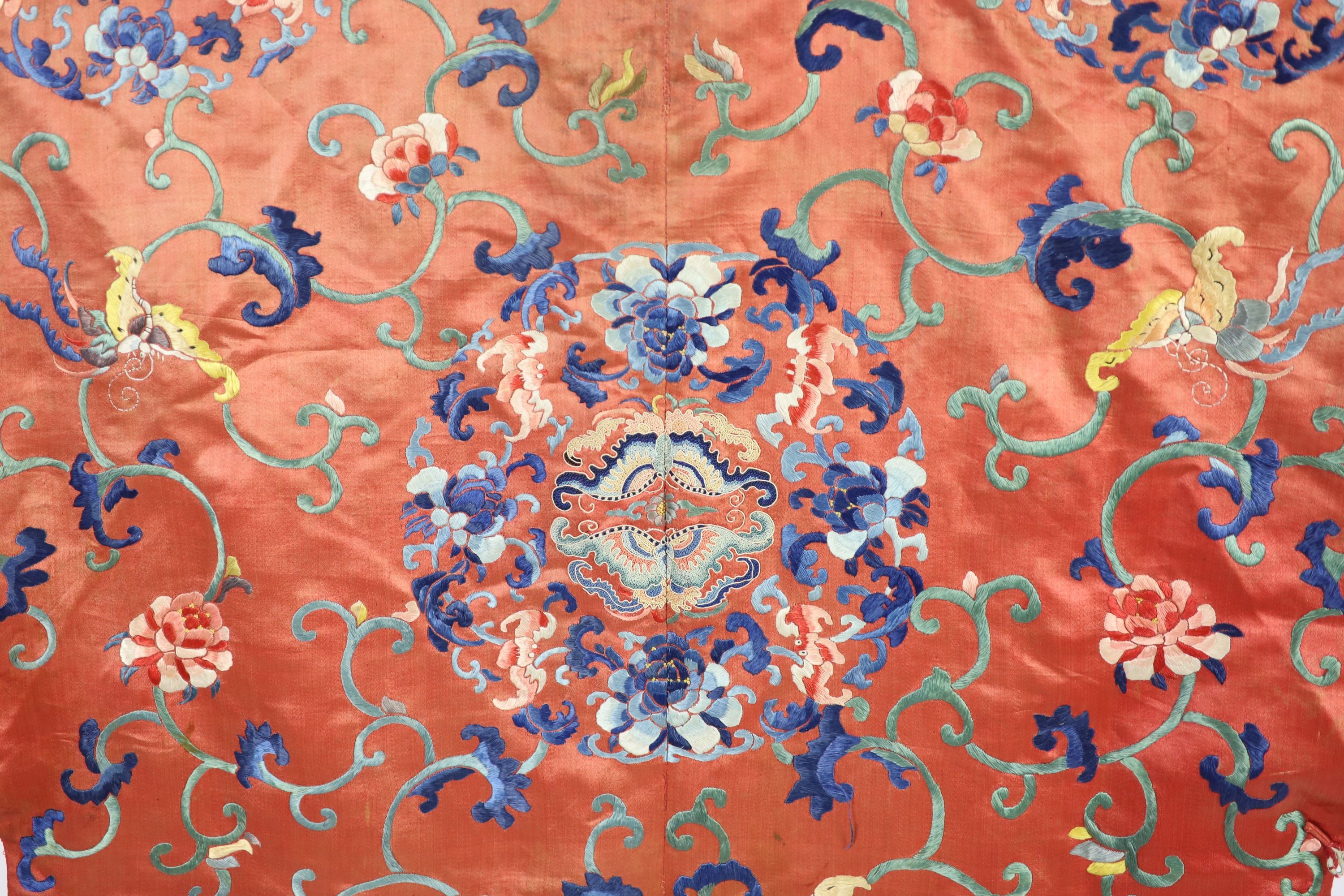 A Chinese apricot silk robe, mid 19th century, 125 cm long, wear to back of collar